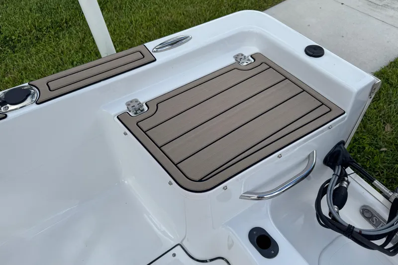 Slide: The Image of 2016 Sportsman Island Reef 17 Center Console boat deck with tan non-slip surface. - 21