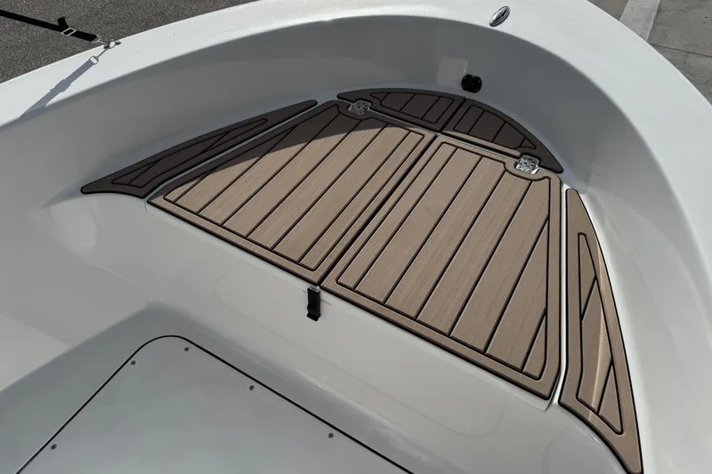 Slide: The Image of 2016 Sportsman Island Reef 17 Center Console boat interior, featuring steering console and seating. - 24
