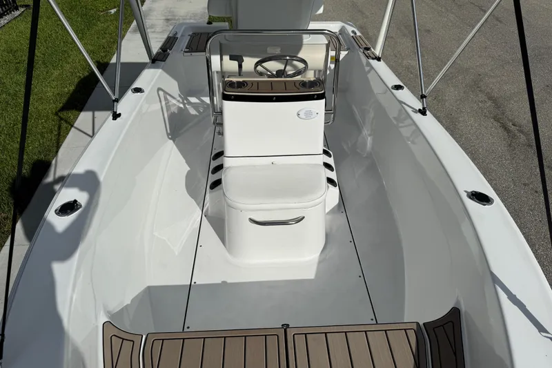 Slide: The Image of Open storage compartment on 2016 Sportsman Island Reef 17 Center Console boat. - 28