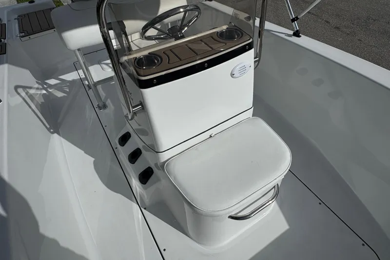 Slide: The Image of Open storage compartment on 2016 Sportsman Island Reef 17 Center Console boat. - 29