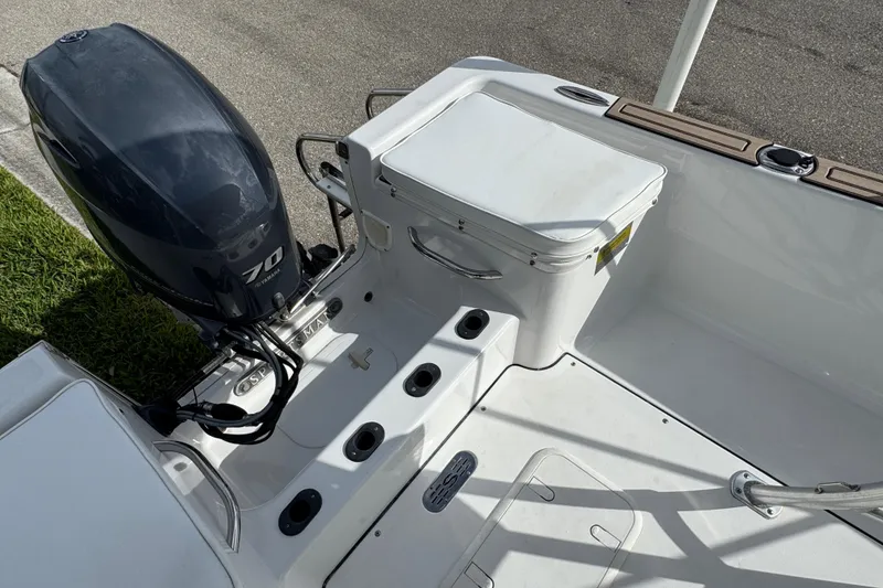 Slide: The Image of 2016 Sportsman Island Reef 17 Center Console capacity label, 5 persons or 900 lbs, 70 HP motor. - 30