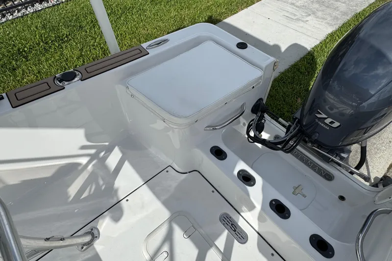 Slide: The Image of 2016 Sportsman Island Reef 17 Center Console boat interior with steering wheel and controls. - 31