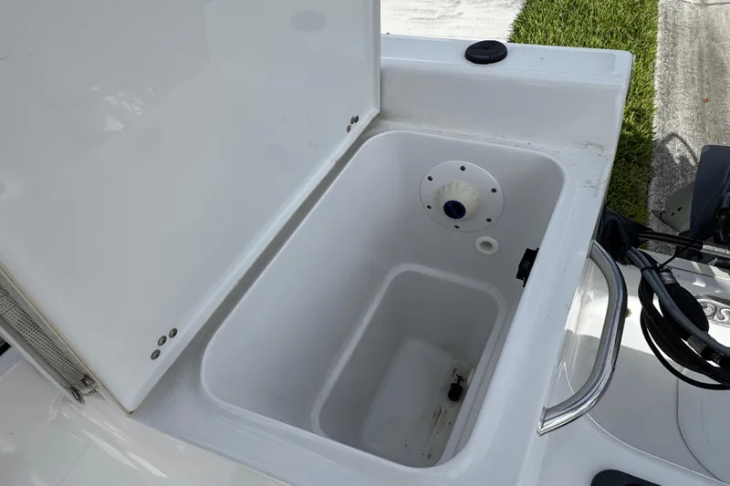 Slide: The Image of 2016 Sportsman Island Reef 17 Center Console boat logo with palm tree and crescent moon. - 32