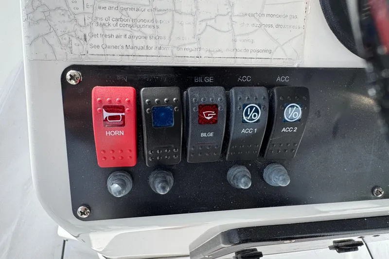 Slide: The Image of 2016 Sportsman Island Reef 17 Center Console boat interior with white seating. - 43