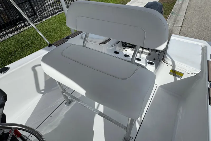Slide: The Image of 2016 Sportsman Island Reef 17 Center Console boat deck with wood finish. - 47