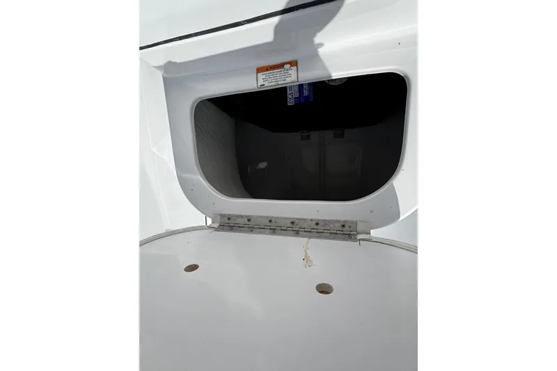 Slide: The Image of Open storage compartment on a 2016 Sportsman Island Reef 17 Center Console boat. - 48