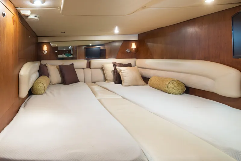 Slide: The Image of Luxurious cabin interior of 2007 Tiara Yachts 4300 Sovran with plush bedding and elegant lighting. - 11