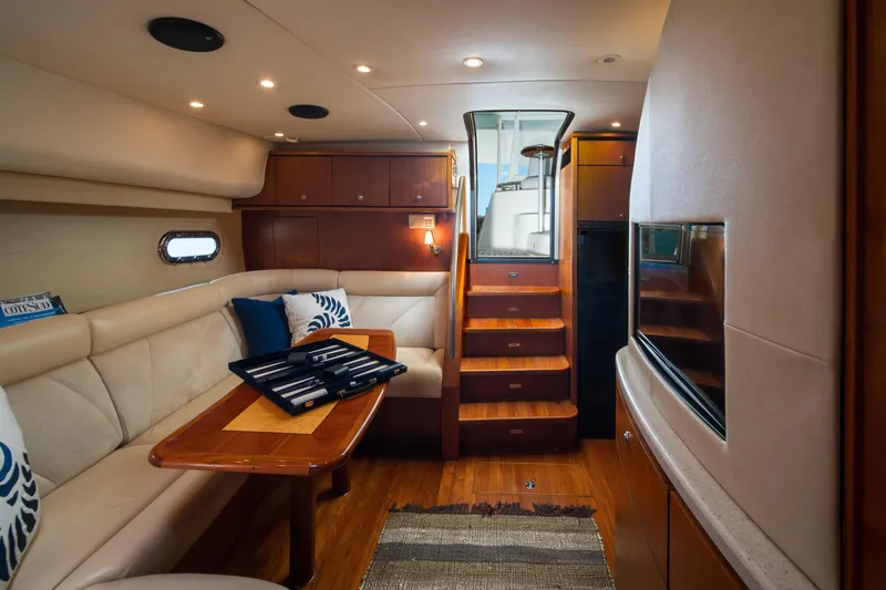 Slide: The Image of Luxurious interior of 2007 Tiara Yachts 4300 Sovran with elegant seating and wooden finishes. - 14