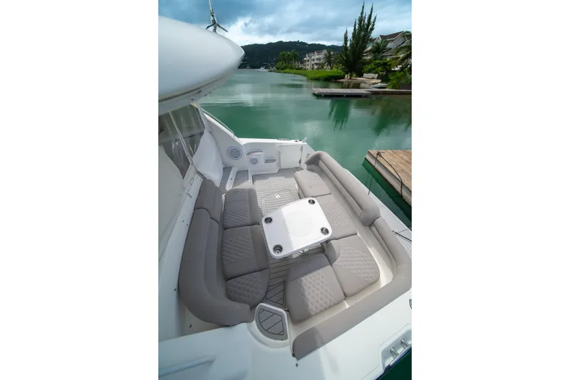 Slide: The Image of Luxurious seating area on a 2007 Tiara Yachts 4300 Sovran, docked by serene waters. - 15