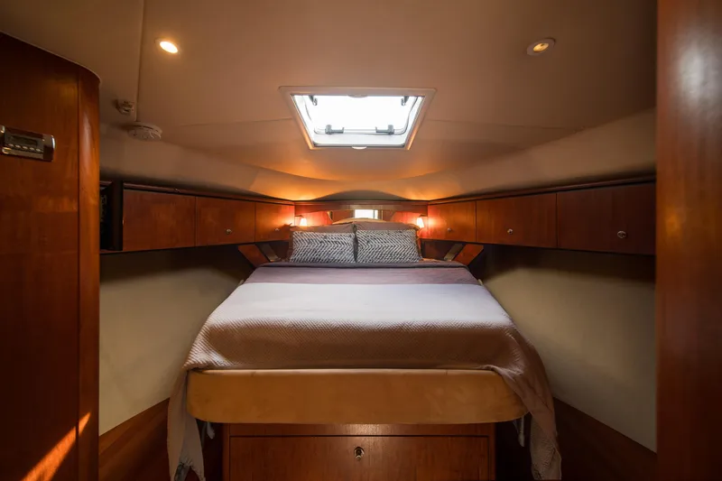 Slide: The Image of Luxurious cabin interior of 2007 Tiara Yachts 4300 Sovran with cozy bed and ambient lighting. - 9
