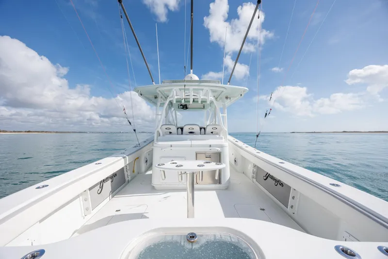 Slide: The Image of 2014 Yellowfin 42 Offshore boat on calm sea under blue sky. - 19