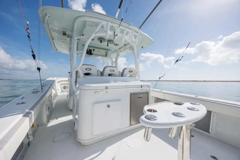 Slide: The Image of 2014 Yellowfin 42 Offshore boat interior with fishing rod holders and seating. - 20