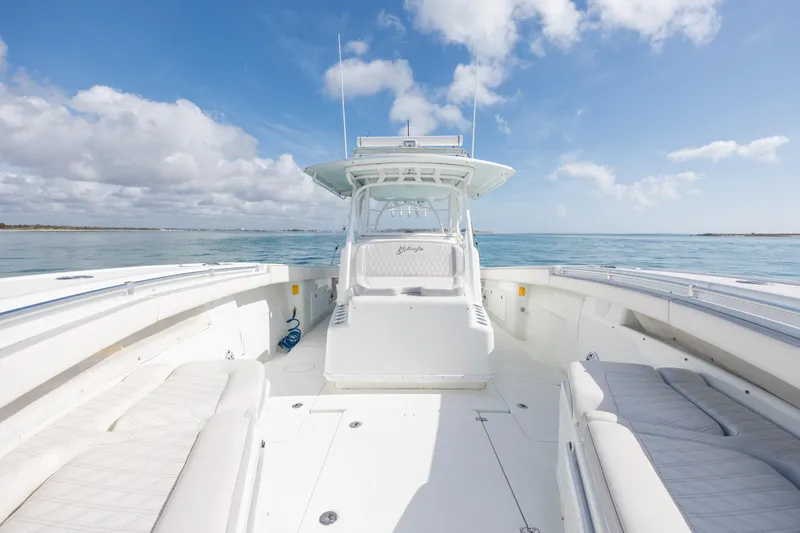 Slide: The Image of 2014 Yellowfin 42 Offshore boat on calm ocean under blue sky. - 30