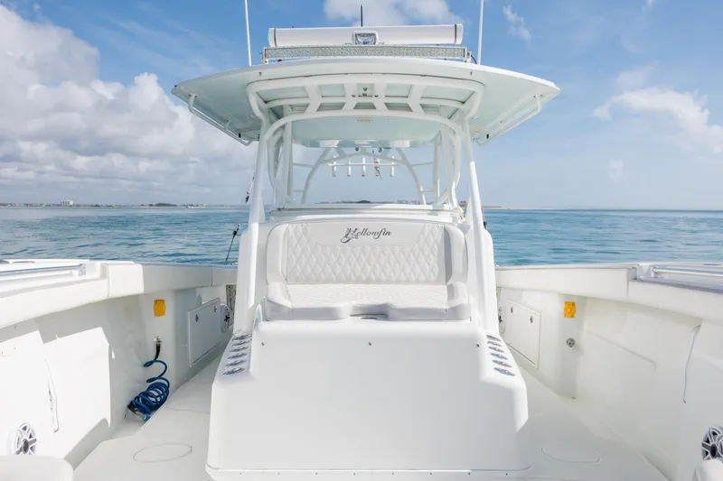 Slide: The Image of 2014 Yellowfin 42 Offshore boat on calm ocean waters under a clear sky. - 31