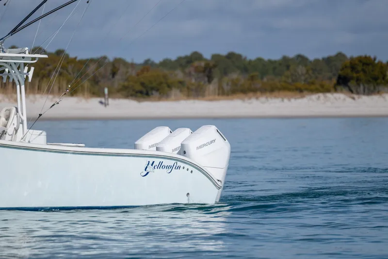 Slide: The Image of 2014 Yellowfin 42 Offshore boat with Mercury engines on calm water. - 4