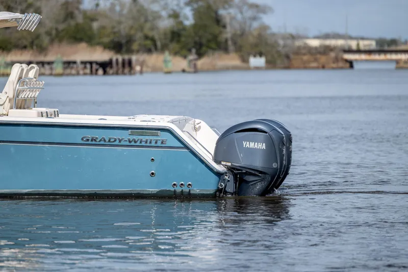 Slide: The Image of 2013 Grady-White Canyon 306 boat with Yamaha engine on calm water. - 11