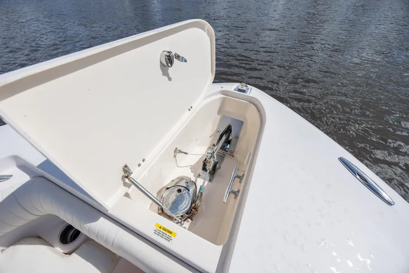 Slide: The Image of Open anchor compartment on 2013 Grady-White Canyon 306 boat, near water. - 30
