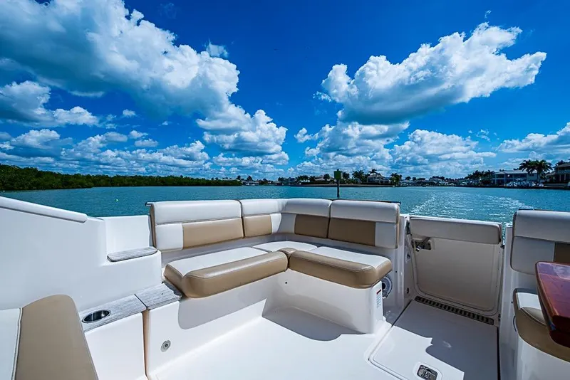 Slide: The Image of Luxurious seating on 2012 Tiara Yachts 3100 Coronet, with scenic waterfront view. - 14