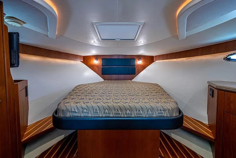 Slide: The Image of Luxurious cabin interior of 2012 Tiara Yachts 3100 Coronet with elegant wood finishes. - 19