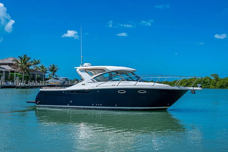 Slide: The Image of 2012 Tiara Yachts 3100 Coronet cruising on calm blue waters under clear skies. - 4