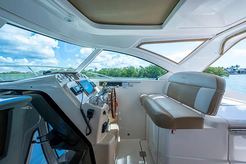 Slide: The Image of 2012 Tiara Yachts 3100 Coronet helm with leather seating and modern controls. - 8