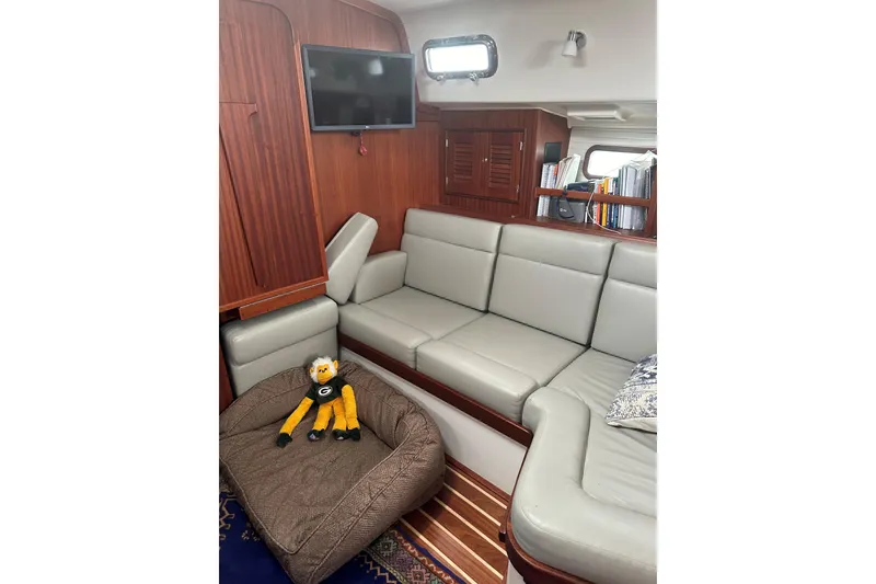 Slide: The Image of Interior of 2023 Island Packet 439 yacht with cozy seating and plush toy. - 3