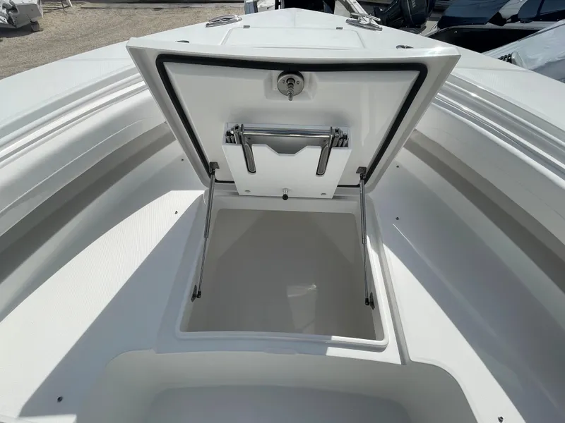 Slide: The Image of Open storage compartment on a 2024 Regulator 34 boat. - 11