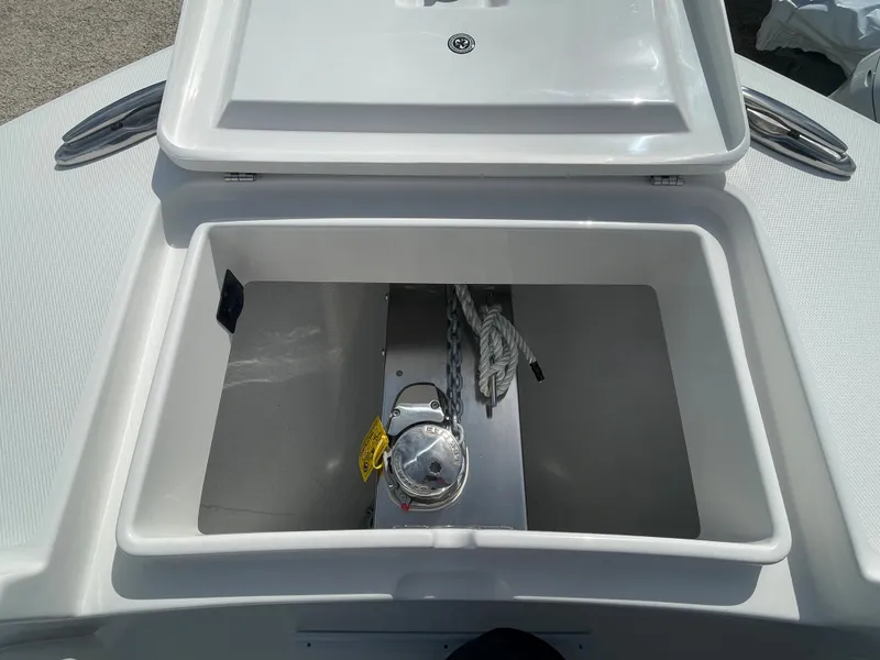 Slide: The Image of Open anchor locker of a 2024 Regulator 34 boat. - 12