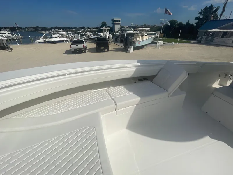 Slide: The Image of 2024 Regulator 34 boat with spacious deck and seating area. - 15