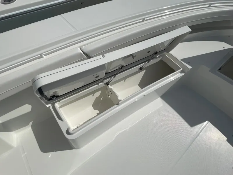 Slide: The Image of Open storage compartment on a 2024 Regulator 34 boat. - 16