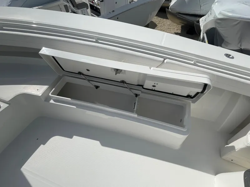 Slide: The Image of 2024 Regulator 34 boat storage compartment open. - 17