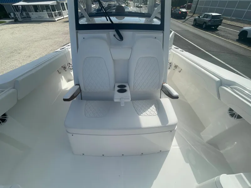 Slide: The Image of 2024 Regulator 34 boat interior with white seating. - 18