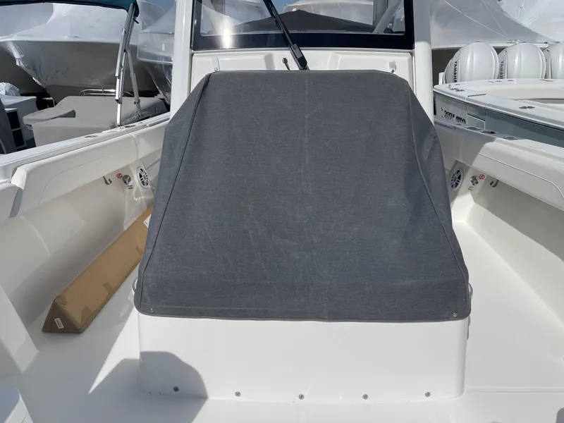 Slide: The Image of 2024 Regulator 34 boat with gray cover in cockpit. - 22
