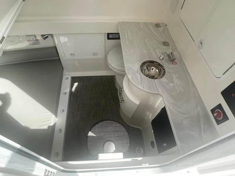 Slide: The Image of 2024 Regulator 34 boat bathroom interior with sink and toilet. - 24