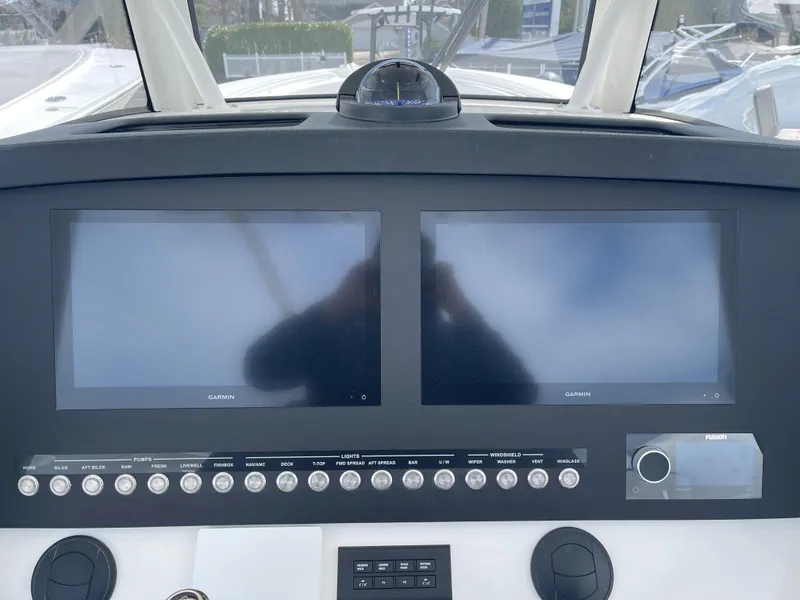 Slide: The Image of 2024 Regulator 34 boat console with dual screens. - 28