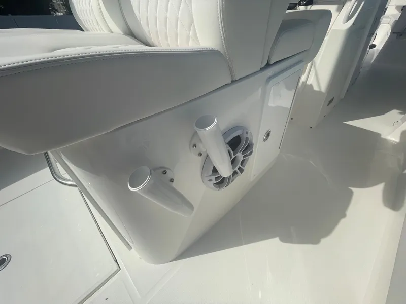 Slide: The Image of Regulator 34 boat 2024, seating area with speaker and holders. - 47