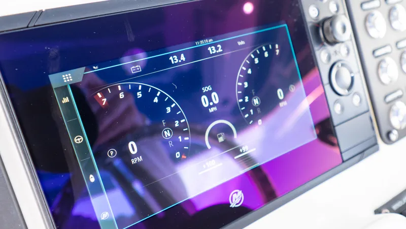 Slide: The Image of Dashboard display of 2022 Intrepid 345 Valor boat, showing speed and navigation metrics. - 16