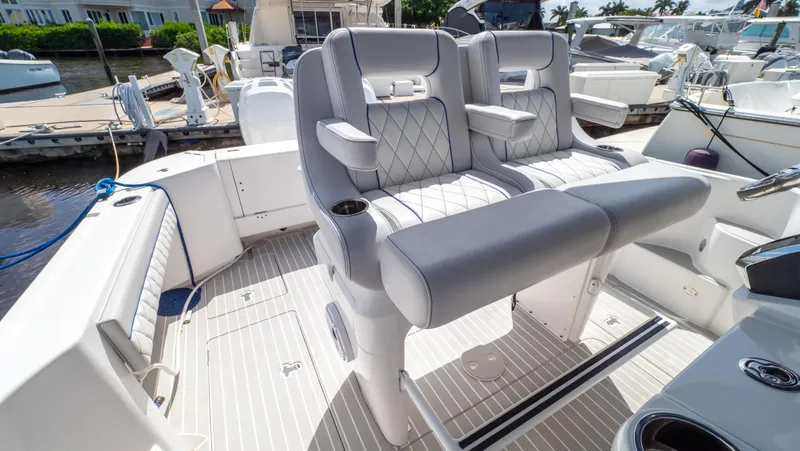 Slide: The Image of 2022 Intrepid 345 Valor boat interior with luxurious seating and modern design. - 3