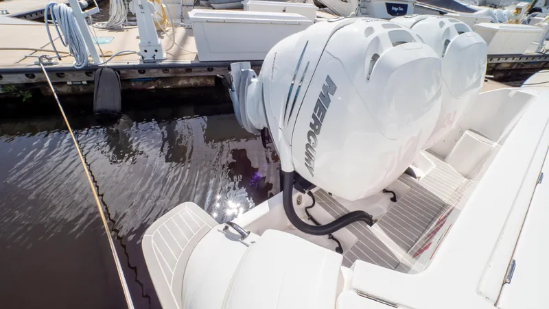 Slide: The Image of 2022 Intrepid 345 Valor with powerful Mercury outboard engines docked at marina. - 45