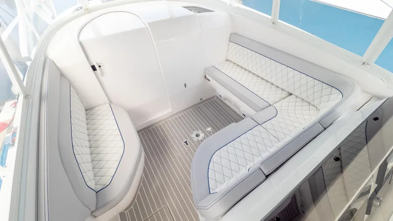 Slide: The Image of 2022 Intrepid 345 Valor boat interior with elegant seating and modern design. - 5