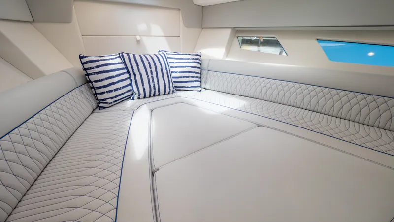 Slide: The Image of Luxurious interior of 2022 Intrepid 345 Valor with striped cushions and elegant seating. - 6
