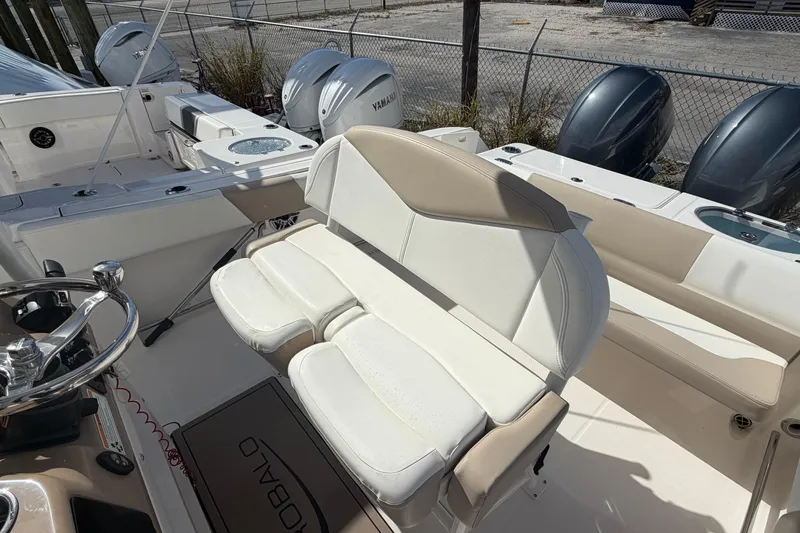 Slide: The Image of 2022 Robalo R242 Center Console boat interior with dual Yamaha engines. - 11
