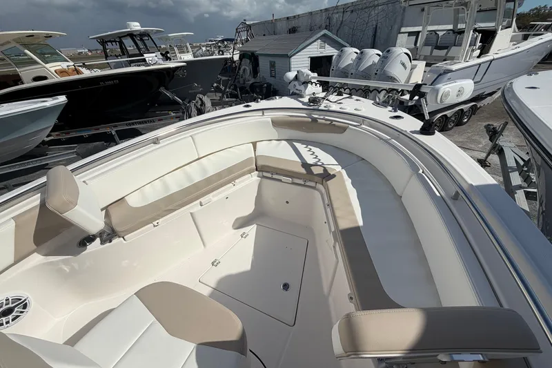 Slide: The Image of 2022 Robalo R242 Center Console boat with spacious seating and modern design. - 7