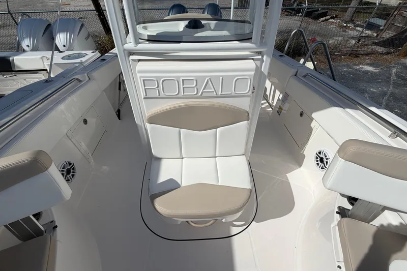 Slide: The Image of 2022 Robalo R242 Center Console boat interior with seating and console details. - 9