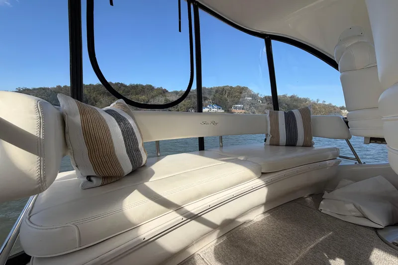 Slide: The Image of Luxurious interior of 2003 Sea Ray 560 Sedan Bridge with plush seating and scenic view. - 18