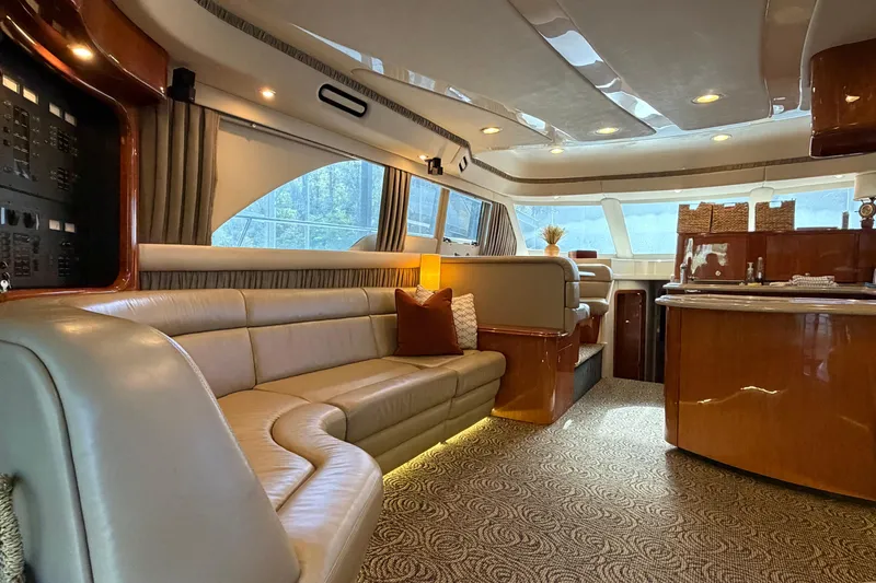 Slide: The Image of Luxurious interior of a 2003 Sea Ray 560 Sedan Bridge yacht with elegant seating and wood finishes. - 3