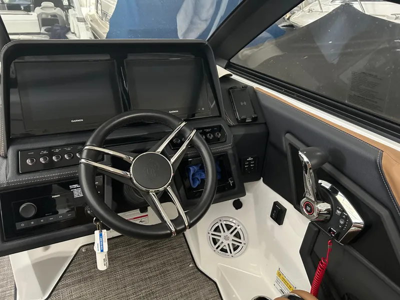 Slide: The Image of 2024 Cobalt R6 boat helm with Garmin displays. - 16