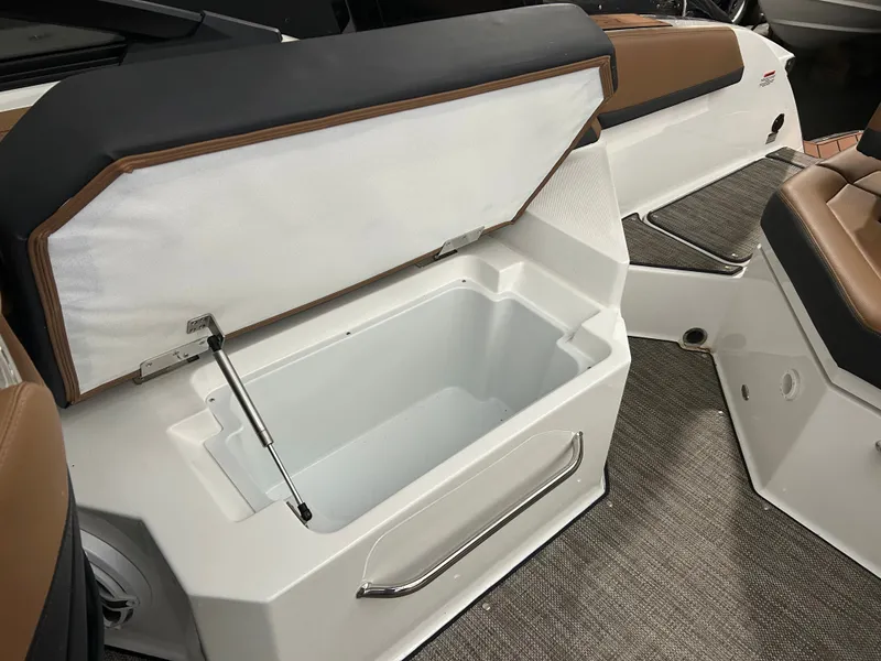 Slide: The Image of Open storage compartment in 2024 Cobalt R6 boat. - 22