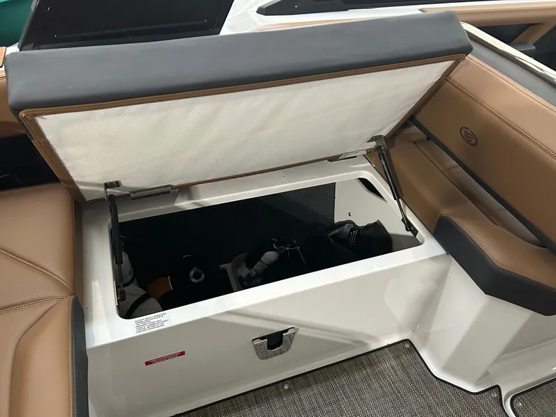 Slide: The Image of Open storage compartment in 2024 Cobalt R6 boat. - 23