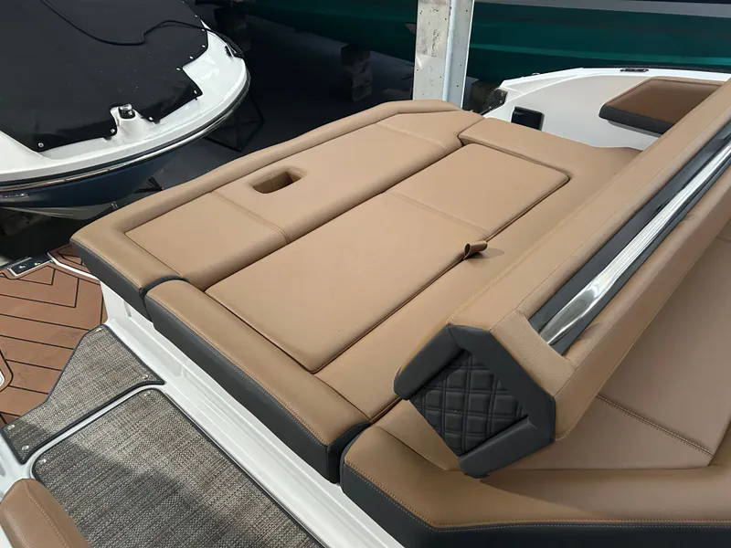 Slide: The Image of 2024 Cobalt R6 boat with luxurious brown upholstered seating. - 31